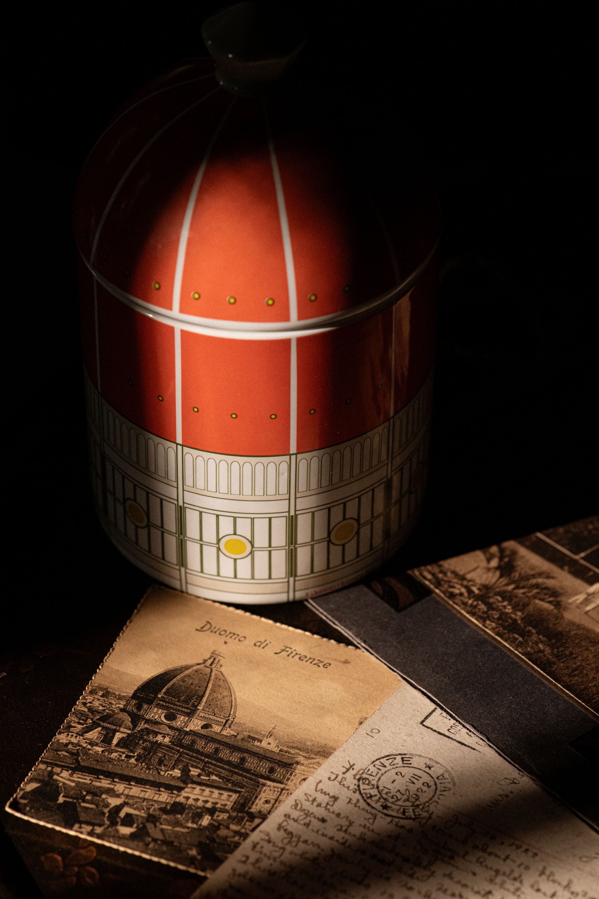 Rogue Paq Il Duomo Heaven Scent candle in the spotlight with a vintage postcard from Florence, Italy.