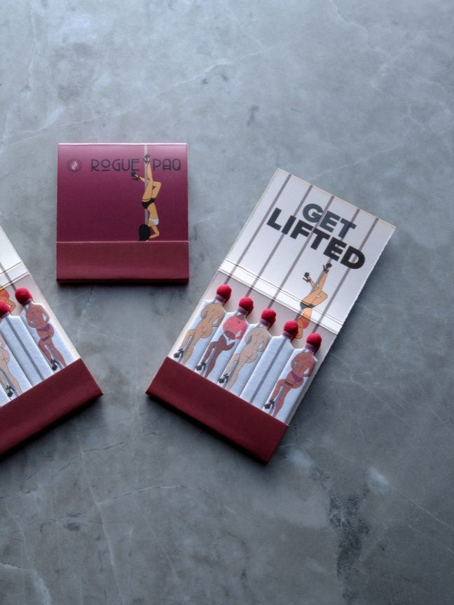 Rogue Paq SendNudes Matches: Get Lifted set of 3 premium matchbooks featuring vintage-style pole dancer illustrations for a cheeky and elevated cannabis ritual