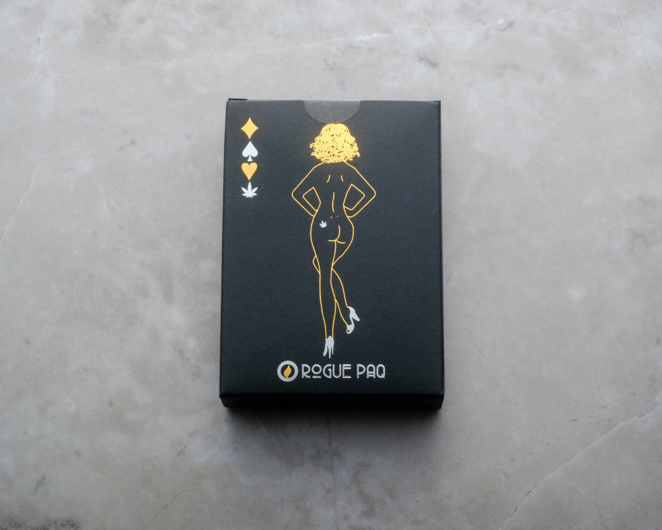 Individual deck of Rogue Paq SendNudes playing cards in a matte-finish tuck box with gold and silver foil stamping; high-design cards featuring custom 'Canna-Clubs' suits.. A perfect gift for a card collector.