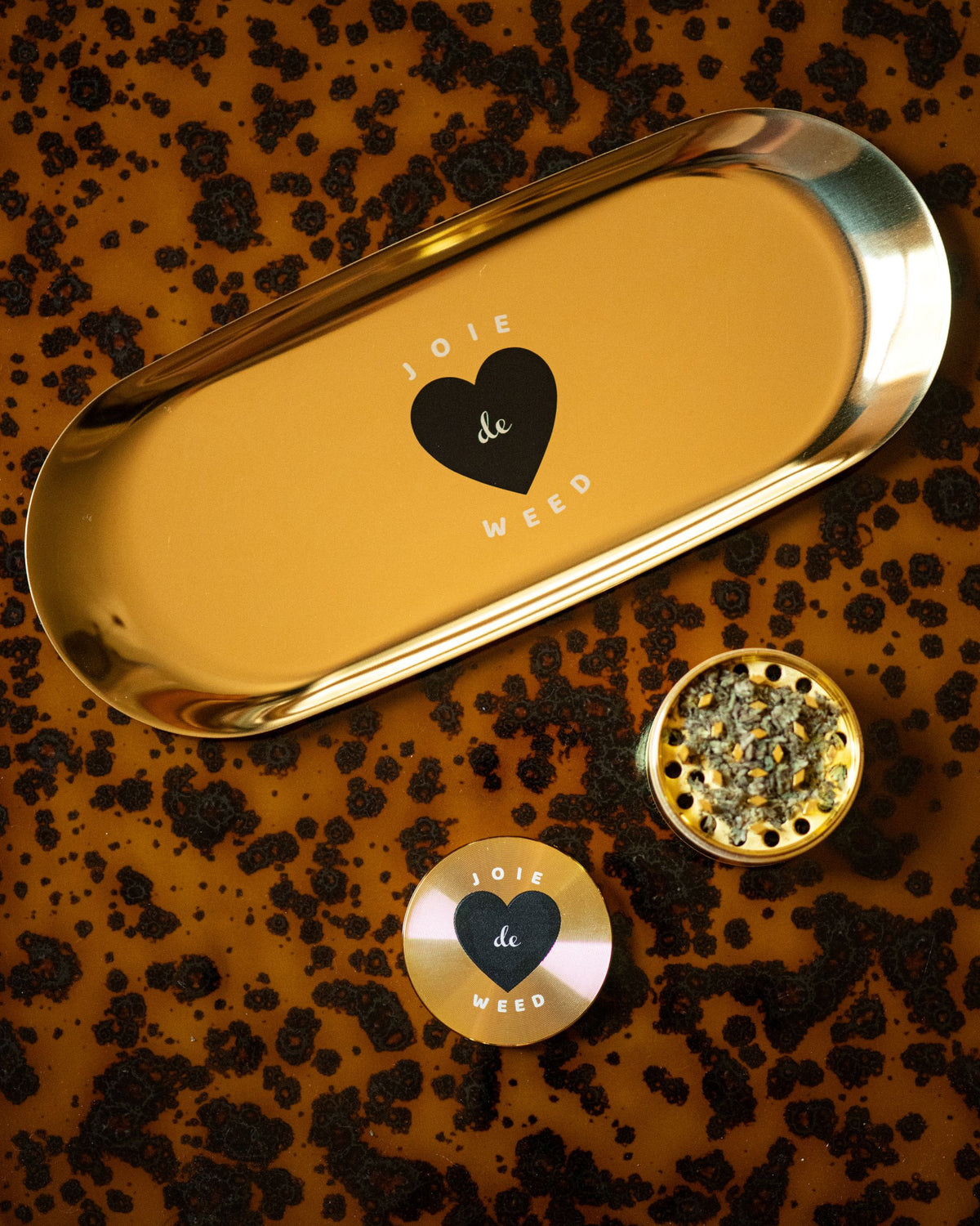 Joie de Weed Grinder with its corresponding travel rolling tray. The perfect pair to raise your ritual.