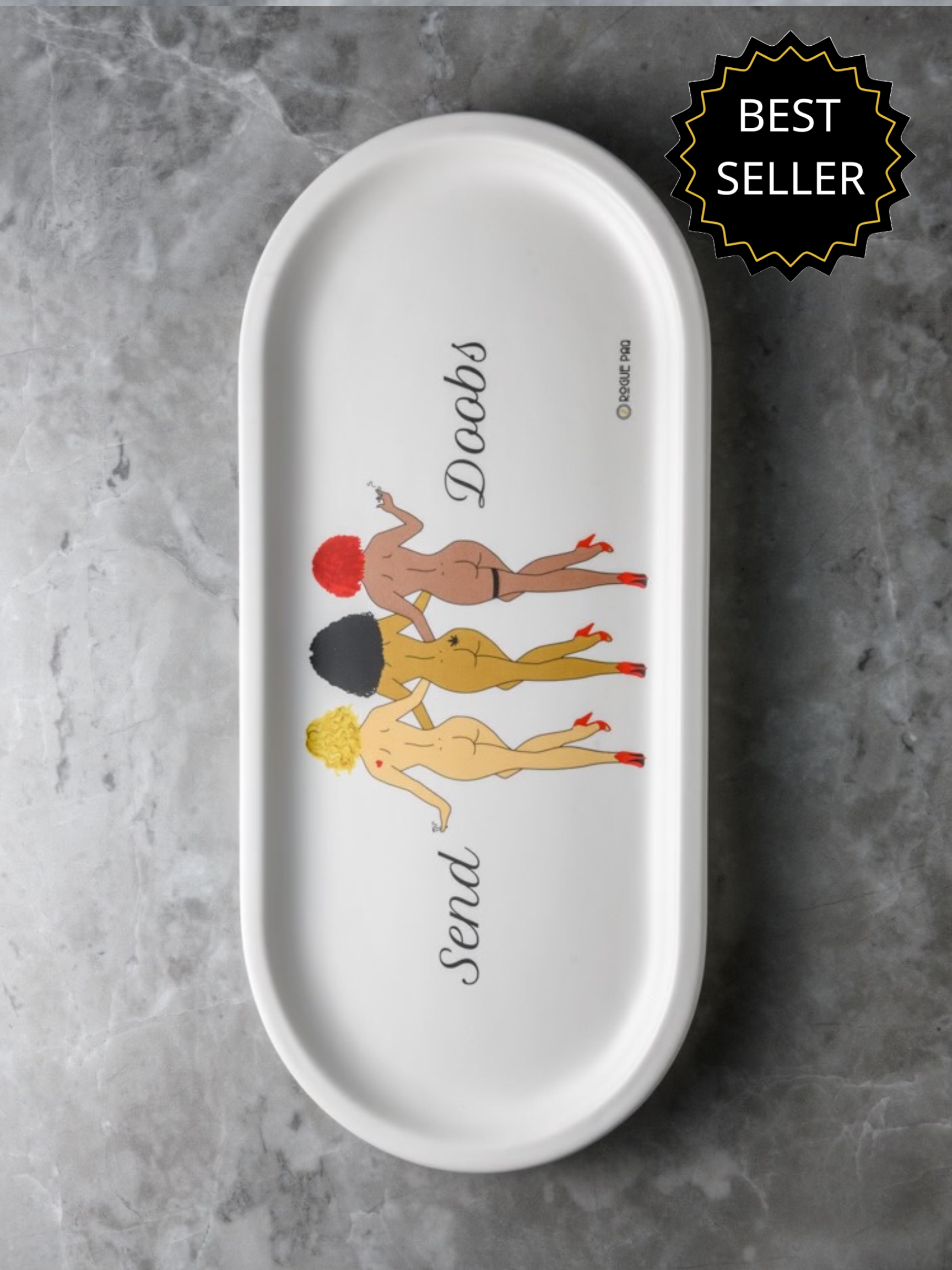 Rogue Paq 'Send Doobs' porcelain valet rolling tray featuring vintage-inspired pin-up art and typography; an oval 12.5-inch catch-all with a sophisticated matte glaze.