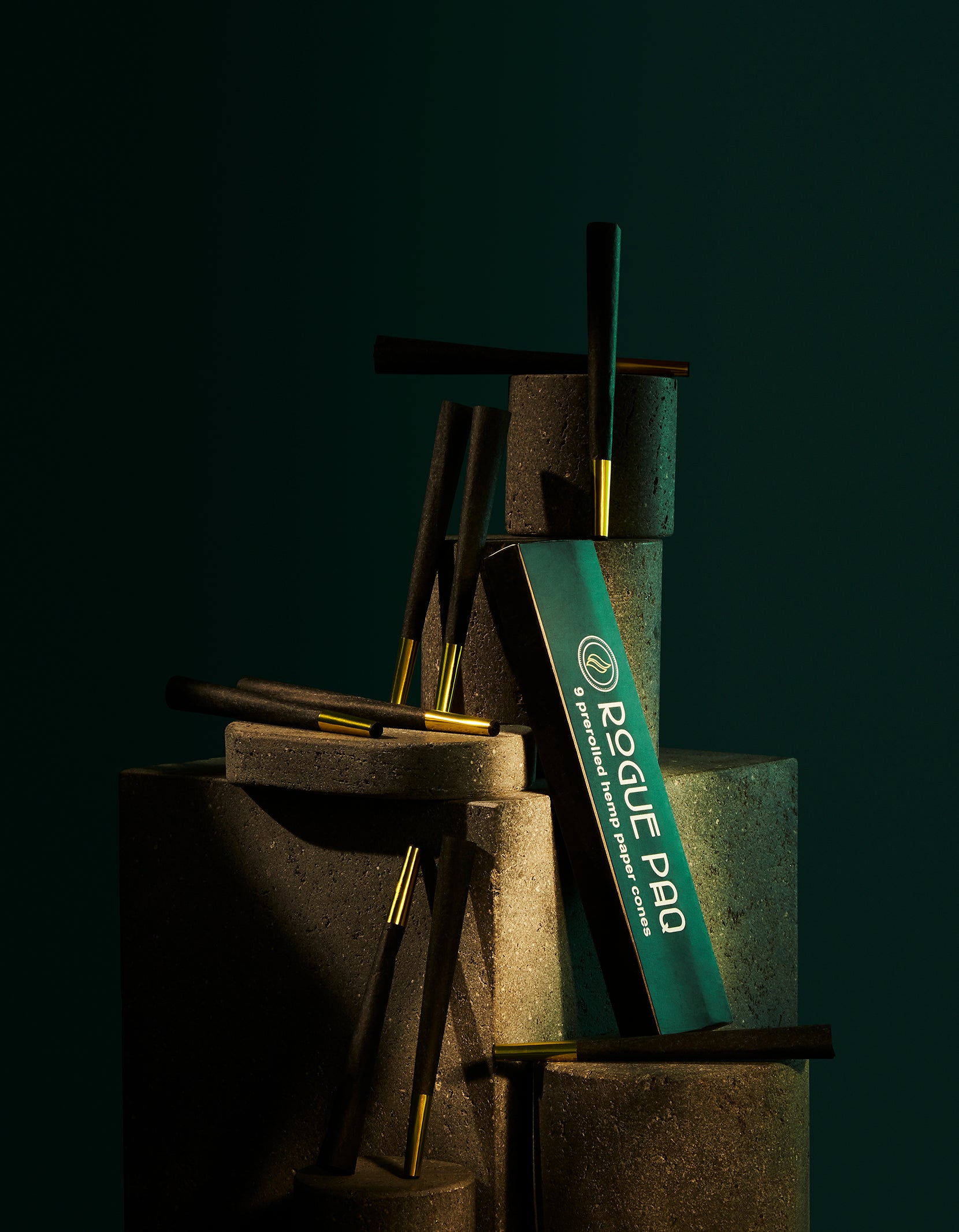 Set of 9 Rogue Paq pre-rolled cones nested in groups of three with included tamping tool; a convenient and design-forward alternative to hand-rolling joints.