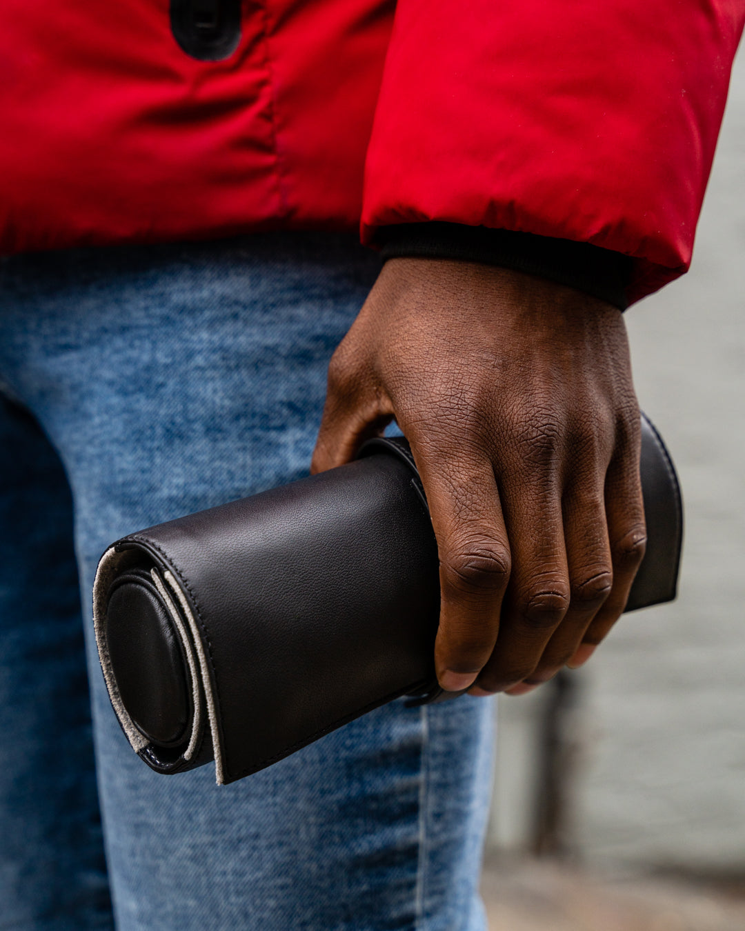 Man's hands holding Rogue Paq Black Leather Ritual Case