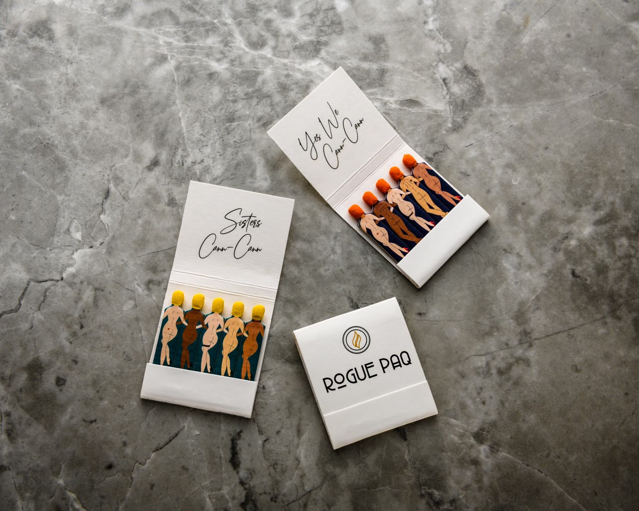 Cann Cann series safety matches; Open Rogue Paq matchbooks displaying individually printed match stems; premium safety matches designed for a clean and reliable burn and to make your ritual fun, inclusive, and playful