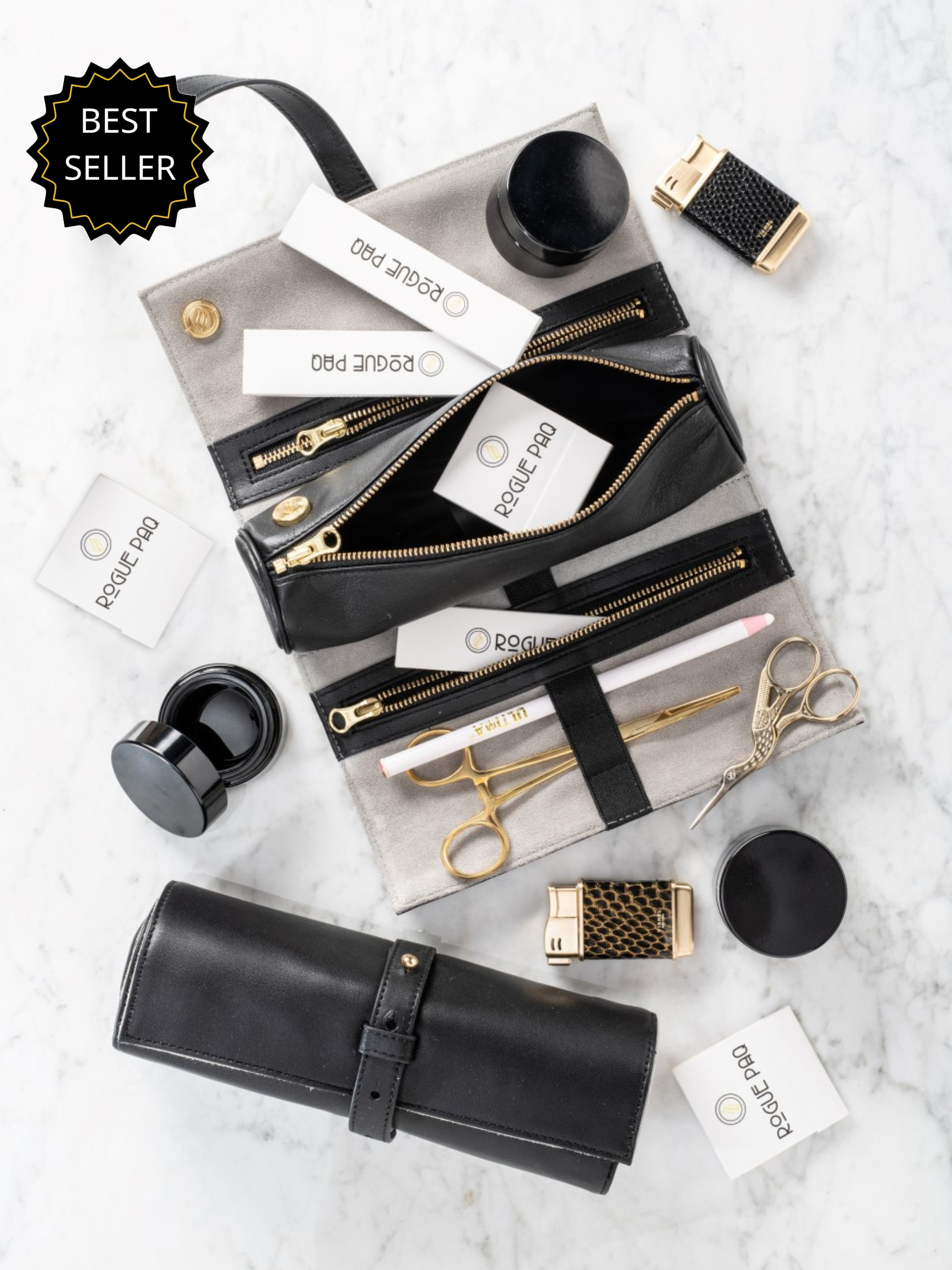 Rogue Paq Full Ritual Cannabis Gift Set in black leather; featuring a curated collection of gold-tone tools, UV glass storage jars, and a scent-suppressant stash bag for the ultimate elevated experience.