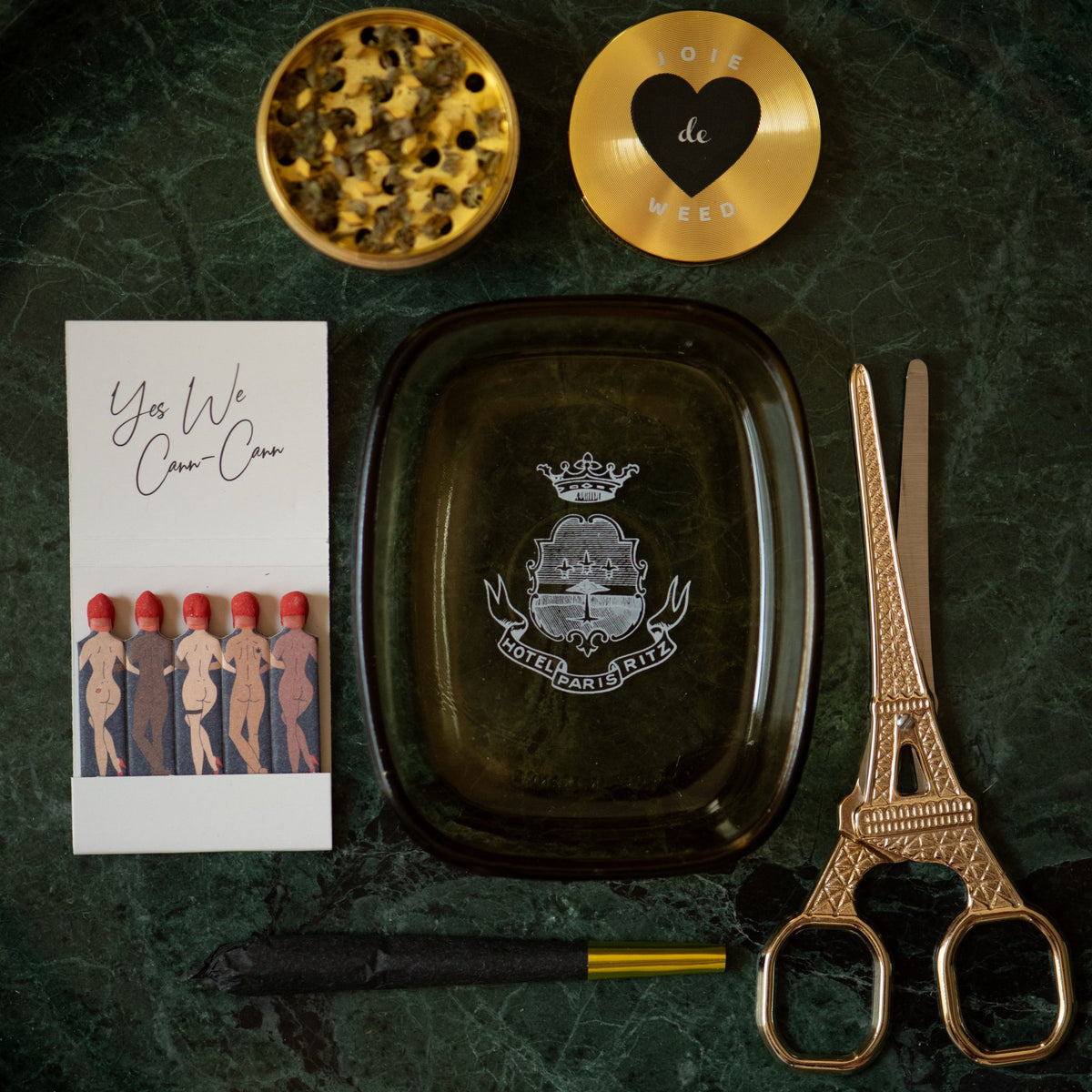 Yes with Cann Cann matches featured along other Parisian inspired accessories by Rogue Paq - Eiffel Tower Scissors, a cone, and the Joie de Weed Grinder.