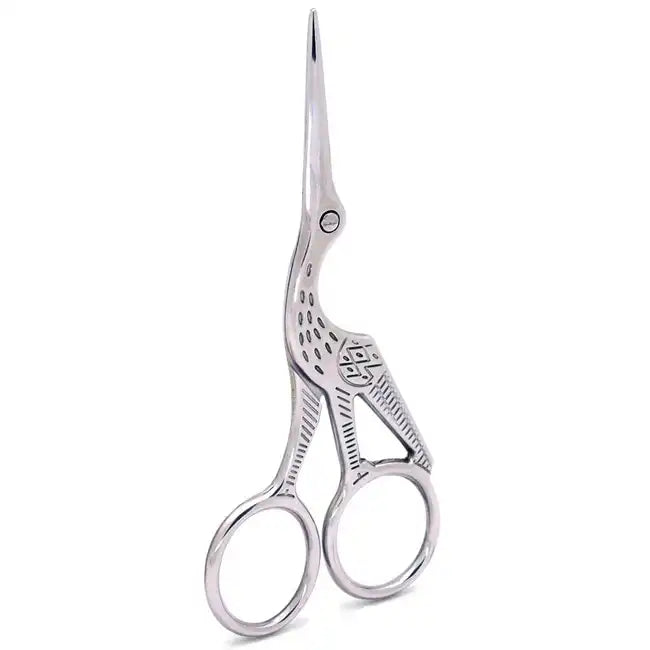 A pair of silver-toned precision trim scissors designed in the shape of a crane. The body of the bird forms the handles, while the long, slender beak serves as the sharp, stainless steel blades, finished in a high-polish silver finish for a luxury aesthetic.