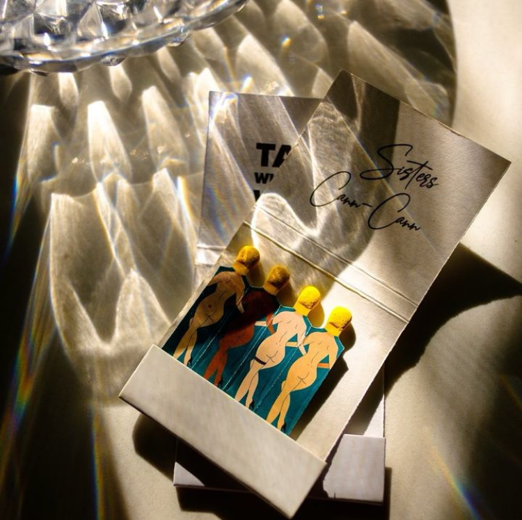 SendNudes Matchbooks styled with a crystal ashtray featuring artistic female form graphics for sophisticated coffee table decor or a luxury smoking kit