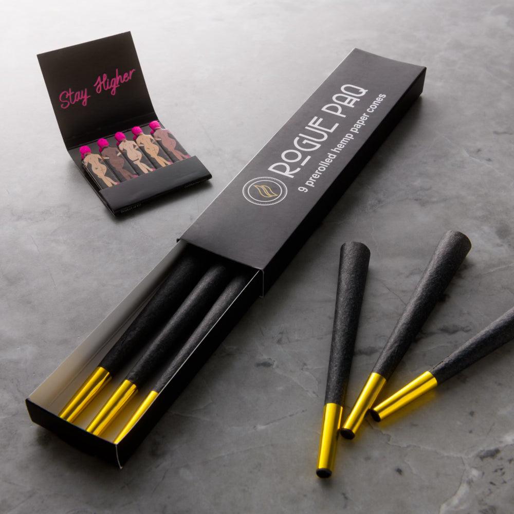 Close-up of all-natural black hemp paper cones with non-smokable gold foil tips; featuring a plant-based coloring and inherent zig-zag crutch for a smooth, chemical-free burn.