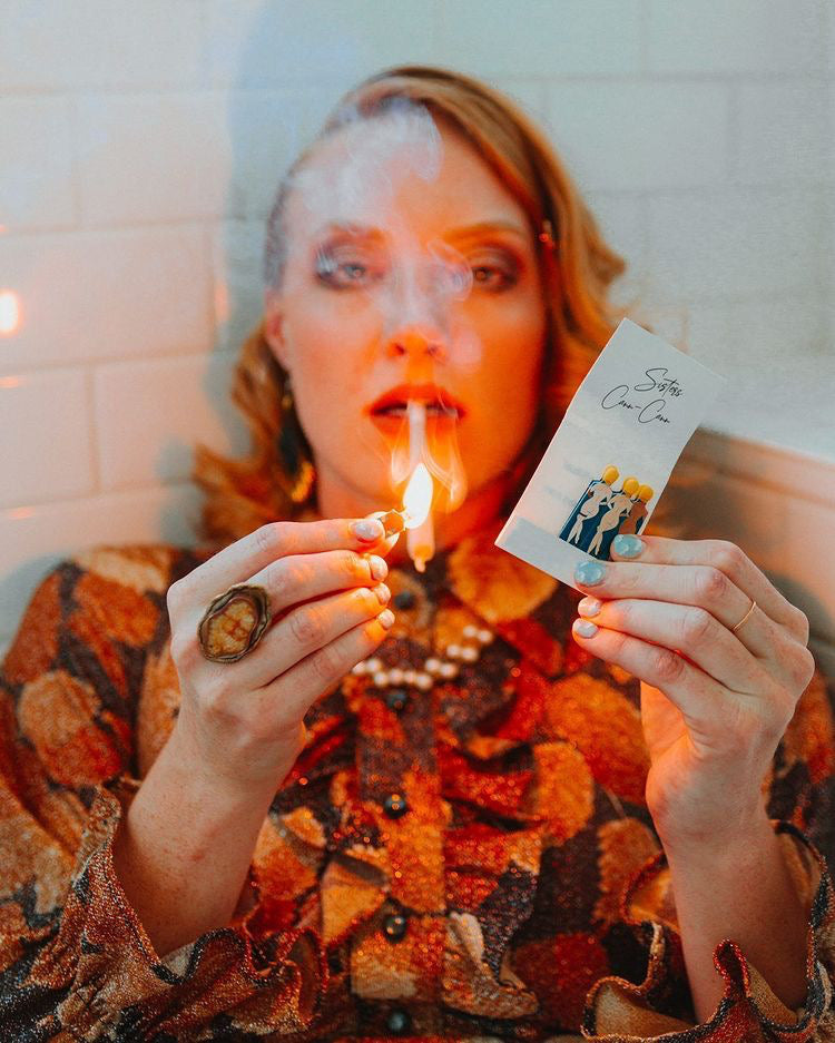 Open book of safety matches with decorative printed stems, a cute and functional accessory for candles or cannabis rituals.